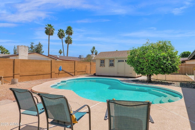 view of pool with an outdoor structure, a patio, a fenced in pool, and a fenced backyard