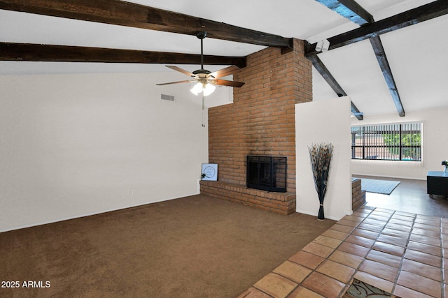 unfurnished living room featuring visible vents, a fireplace, a ceiling fan, and beamed ceiling