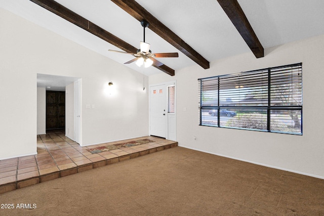 unfurnished living room featuring a ceiling fan, carpet flooring, baseboards, and lofted ceiling with beams