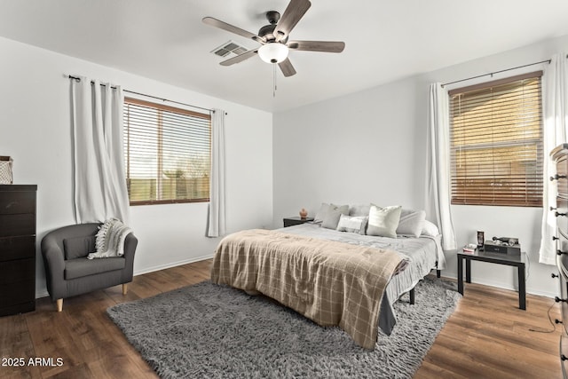 bedroom featuring dark wood-type flooring and ceiling fan