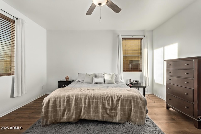 bedroom with wood-type flooring and ceiling fan