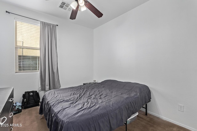 bedroom with dark carpet and ceiling fan