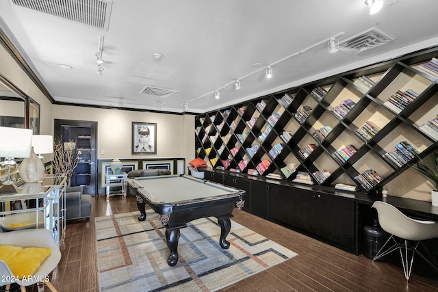 game room featuring ornamental molding, dark wood-type flooring, track lighting, and pool table