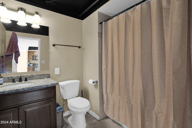 bathroom with tile patterned flooring, vanity, and toilet