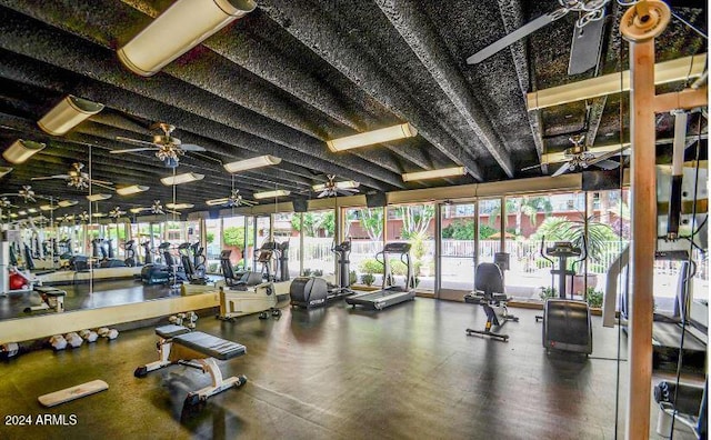 workout area with ceiling fan and a healthy amount of sunlight