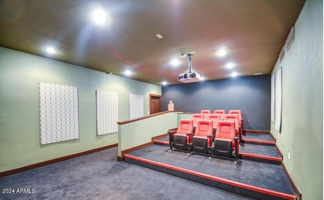 home theater room featuring dark carpet