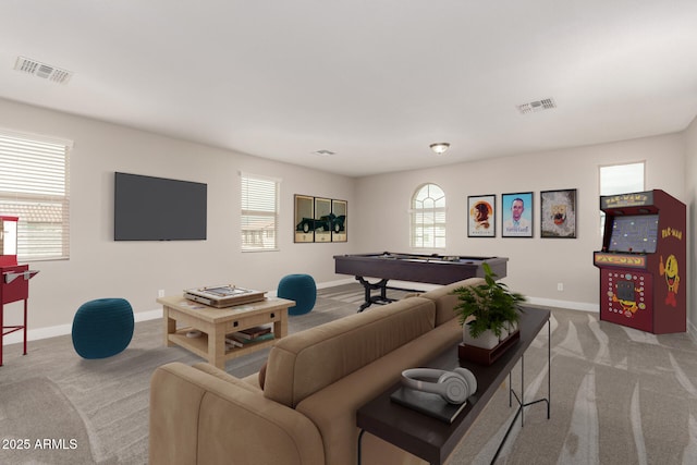 living room with pool table and light colored carpet