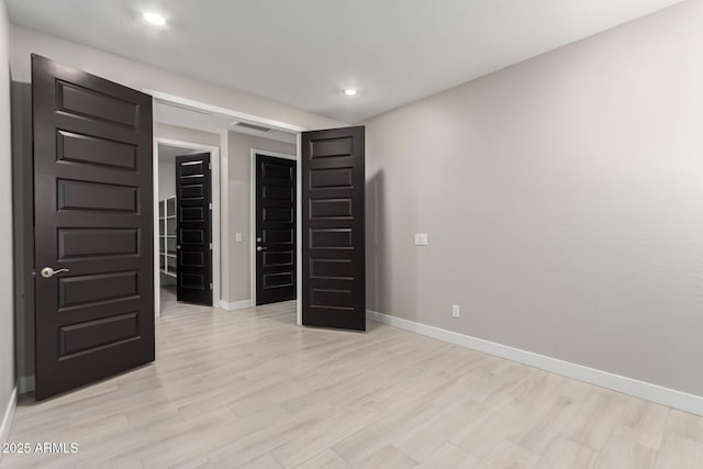 unfurnished bedroom featuring light hardwood / wood-style floors