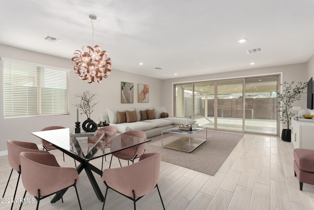 living room with a notable chandelier