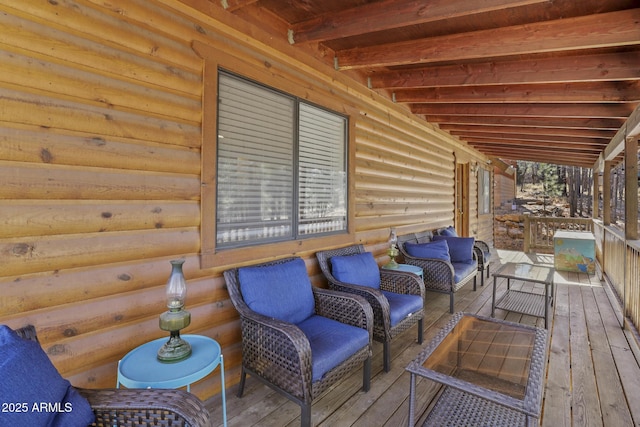 wooden terrace featuring an outdoor living space