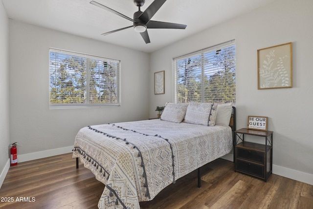 bedroom featuring dark wood-type flooring and ceiling fan