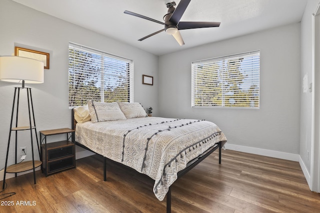 bedroom featuring dark hardwood / wood-style floors and ceiling fan