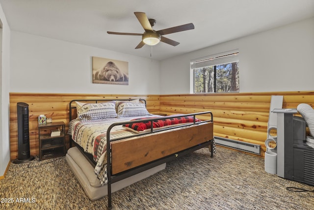 bedroom featuring a baseboard heating unit, log walls, and ceiling fan