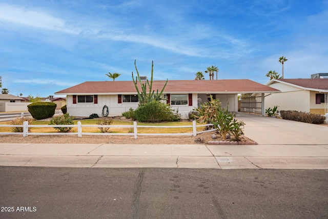 single story home featuring a carport