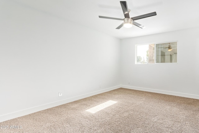 unfurnished room featuring ceiling fan and carpet floors