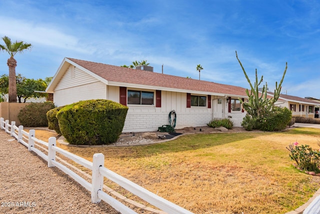 ranch-style home with a front yard