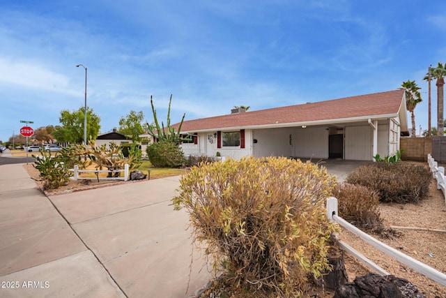 single story home with a carport