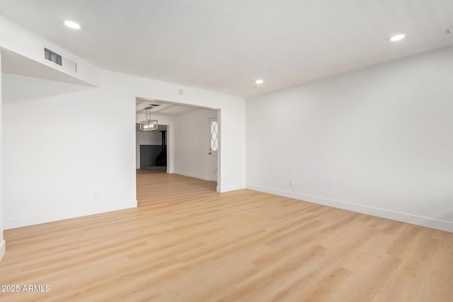 spare room with light wood-type flooring