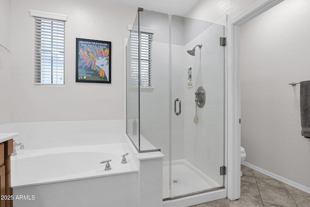 full bathroom with shower with separate bathtub, vanity, toilet, and plenty of natural light