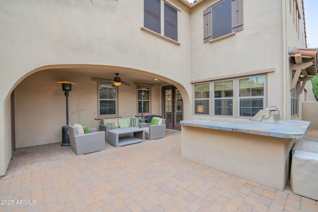 view of patio / terrace featuring an outdoor living space and ceiling fan