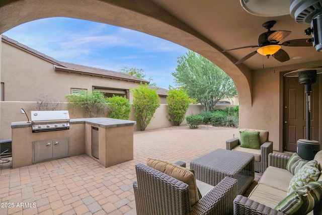 view of patio / terrace featuring ceiling fan, area for grilling, an outdoor hangout area, and grilling area