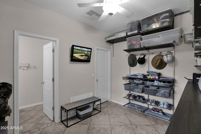 interior space featuring ceiling fan and light tile patterned flooring