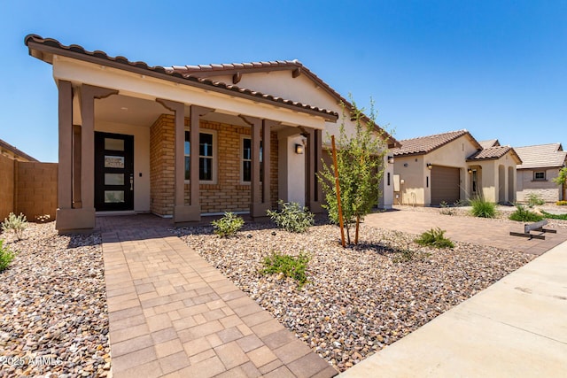 19338 S 212th Pl, Queen Creek, AZ 85142 - mediterranean / spanish house with a tiled roof, a garage, and stucco siding
