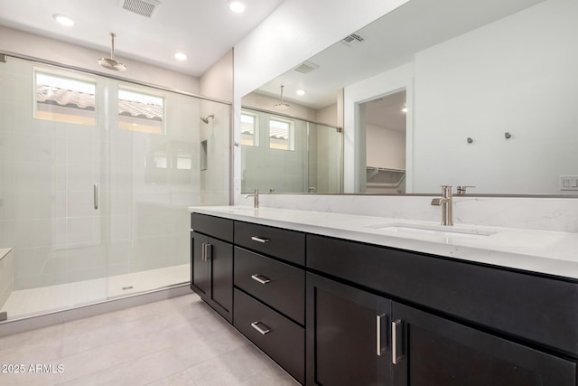 19338 S 212th Pl, Queen Creek, AZ 85142 - full bathroom with a shower stall, double vanity, tile patterned floors, and a walk in closet