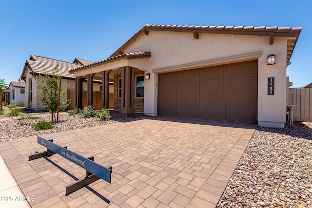 19338 S 212th Pl, Queen Creek, AZ 85142 - mediterranean / spanish house featuring stucco siding, a garage, decorative driveway, and a tiled roof