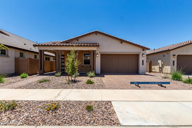 19338 S 212th Pl, Queen Creek, AZ 85142 - mediterranean / spanish house with a tiled roof, stucco siding, an attached garage, and driveway