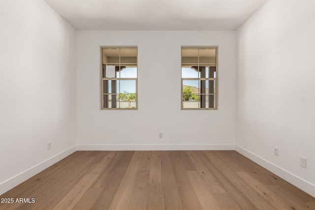 19338 S 212th Pl, Queen Creek, AZ 85142 - spare room featuring light wood-style floors and baseboards