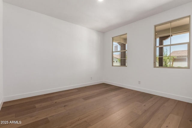 19338 S 212th Pl, Queen Creek, AZ 85142 - spare room featuring hardwood / wood-style flooring and baseboards