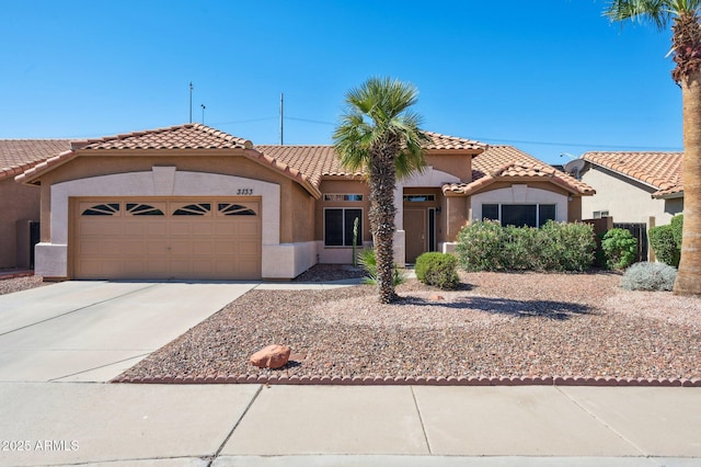3133 E Redwood Ct, Phoenix, AZ 85048 - mediterranean / spanish-style house featuring stucco siding, a garage, and a tiled roof