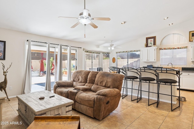 3133 E Redwood Ct, Phoenix, AZ 85048 - living room with a ceiling fan, light tile patterned flooring, and vaulted ceiling