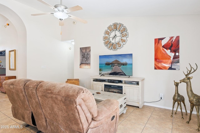 3133 E Redwood Ct, Phoenix, AZ 85048 - living room with light tile patterned floors, arched walkways, and a ceiling fan