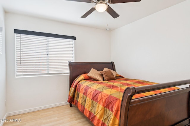 3133 E Redwood Ct, Phoenix, AZ 85048 - bedroom with light wood-style flooring and ceiling fan