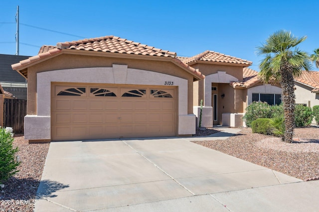 3133 E Redwood Ct, Phoenix, AZ 85048 - mediterranean / spanish house featuring stucco siding, a tile roof, a garage, and driveway
