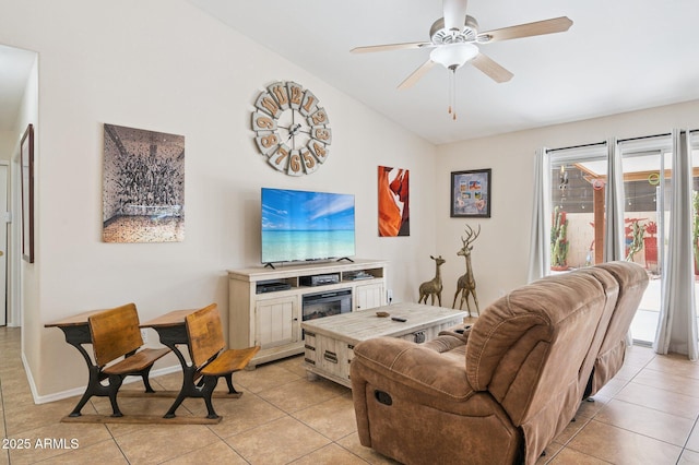 3133 E Redwood Ct, Phoenix, AZ 85048 - living area featuring lofted ceiling, light tile patterned floors, a ceiling fan, and a glass covered fireplace