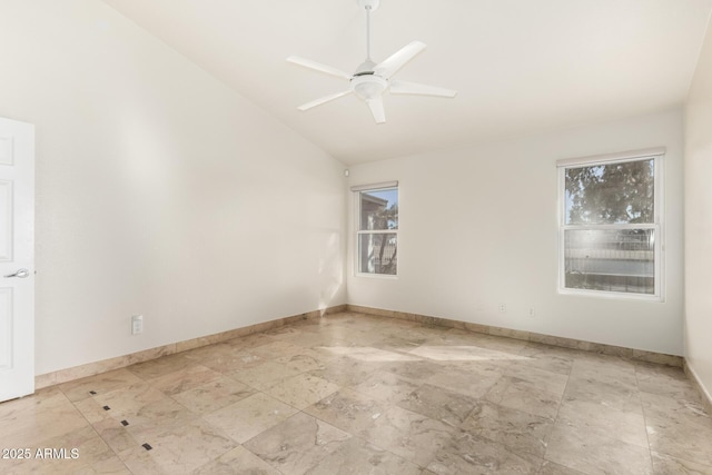 unfurnished room featuring ceiling fan and vaulted ceiling