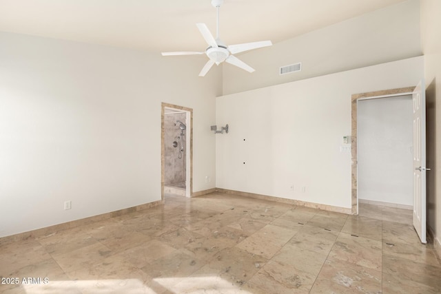 unfurnished room featuring lofted ceiling and ceiling fan