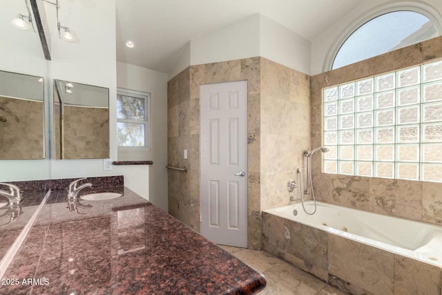 bathroom with vanity and vaulted ceiling