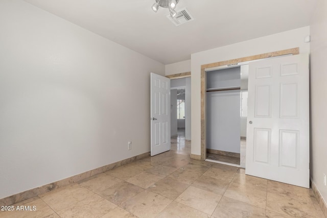 unfurnished bedroom with a closet