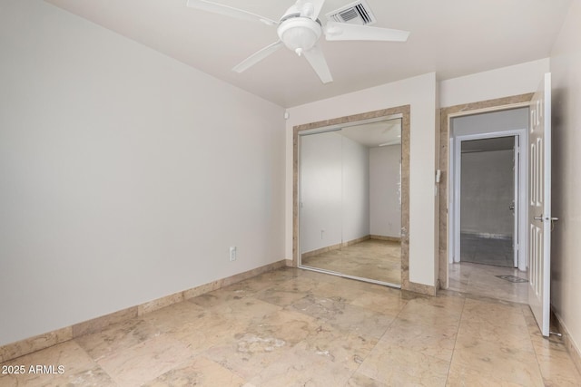 unfurnished bedroom featuring a closet and ceiling fan