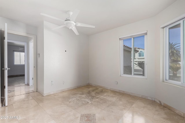 spare room with ceiling fan