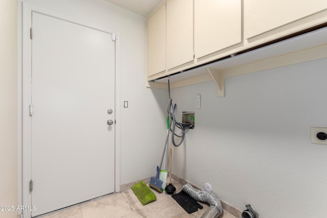 laundry area featuring cabinets, washer hookup, and hookup for an electric dryer