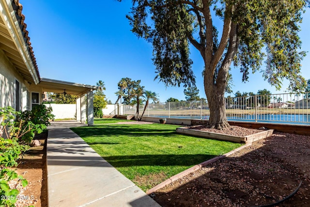 view of yard featuring tennis court