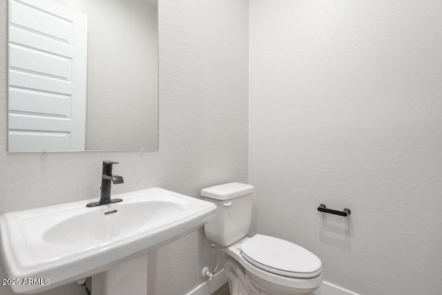 bathroom with a sink and toilet