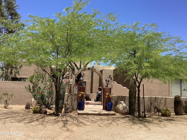 6540 E Wildcat Dr, Cave Creek, AZ 85331 - rear view of property with stucco siding and a gate
