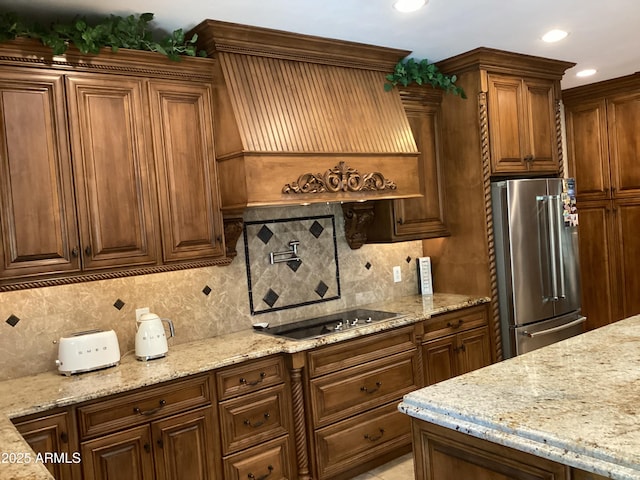 6540 E Wildcat Dr, Cave Creek, AZ 85331 - kitchen featuring high end refrigerator, black electric stovetop, decorative backsplash, light stone countertops, and recessed lighting