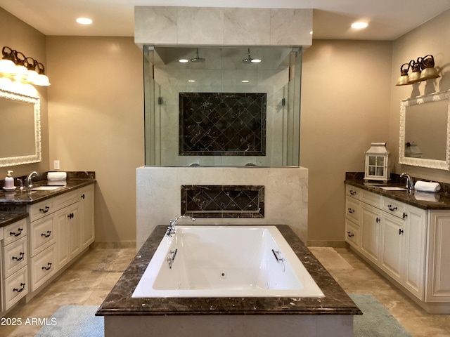 6540 E Wildcat Dr, Cave Creek, AZ 85331 - full bath featuring a shower stall, two vanities, a jetted tub, recessed lighting, and baseboards